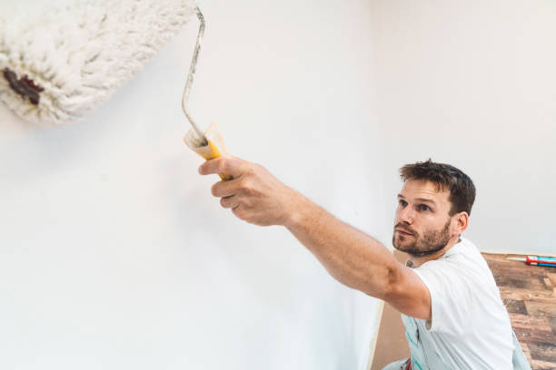 istock Serious face of a painter when painting the wall 1167186874