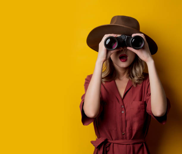 istock Woman in 1940s style clothes with binoculars 1167187172