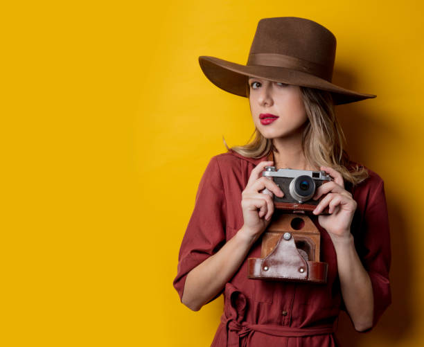 istock Style woman in hat with vintage camera 1167187390