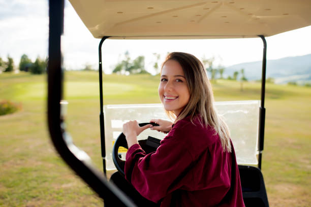 istock woman driving a buggy car on a meadow 1167189177