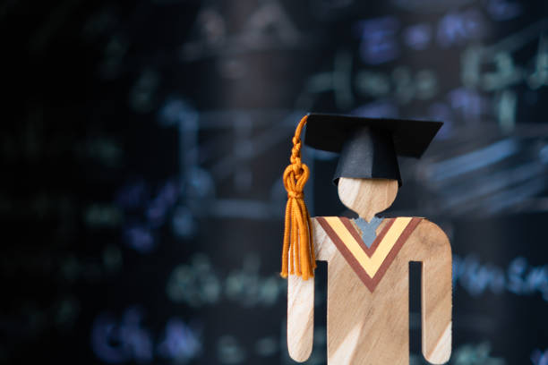 istock Education world, study learning achievement success in abroad global ideas. Graduation cap on  people models on formula equation blackboard background. Congratulation in university 1167189522