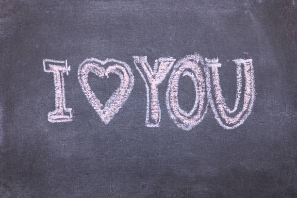 istock I love you. Chalk lettering on blackboard. Multi colored inscription 1167189797