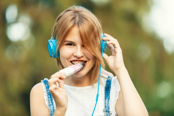 istock Blonde girl eating ice cream 1167190572
