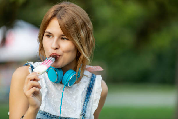 istock Blonde girl eating ice cream 1167190738