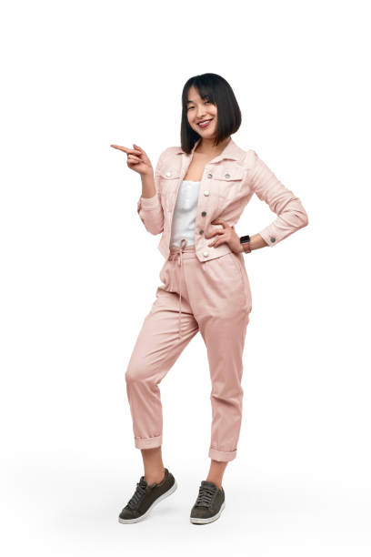 istock Cheerful Asian female pointing aside 1167195258