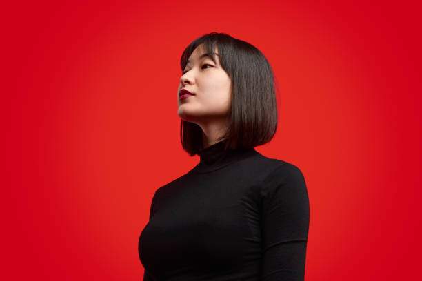istock Stylish Asian woman looking at future 1167195328