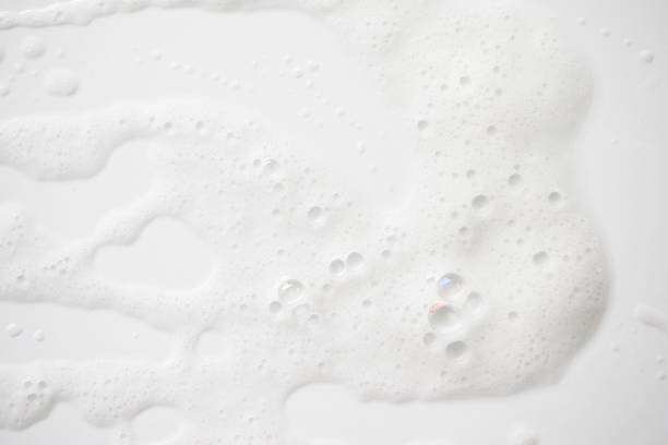 istock Abstract background white soapy foam texture. Shampoo foam with bubbles 1167196728