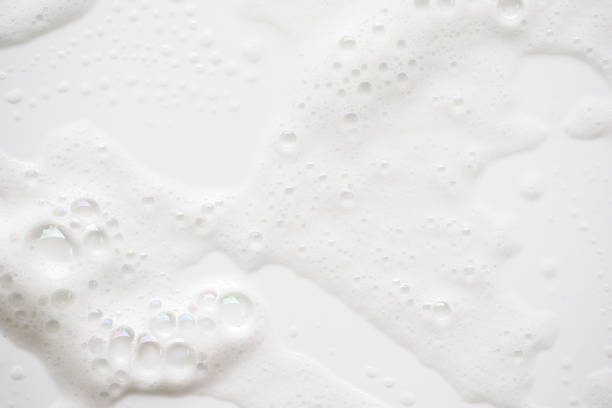 istock Abstract background white soapy foam texture. Shampoo foam with bubbles 1167196734