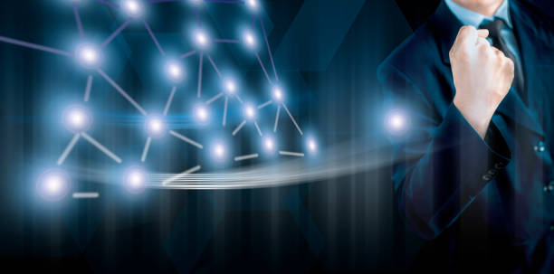 istock Entrepreneur/Businessman/technologist wearing a blue colored blazer and standing against a blue-colored digital virtual imaginative background and showing strength through taking out his hand. 1167199712