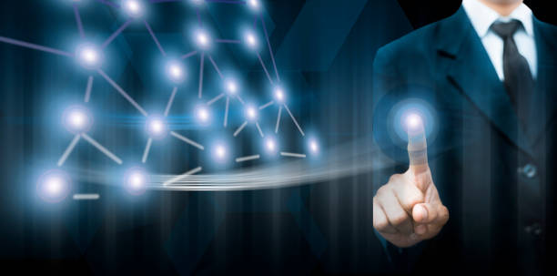 istock Entrepreneur/Businessman/technologist wearing a blue colored blazer and standing against a blue-colored digital virtual imaginative background and touching the virtual screen. 1167199805