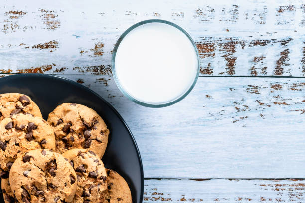 Cookies - Milk - Biscuits Milk, Biscuits, Cookies, Milk Bottle, Drinking Glass chocolate chip cookie top view stock pictures, royalty-free photos & images