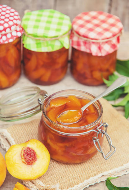 istock Preservation of peach jam. Selective focus. food. 1167204112