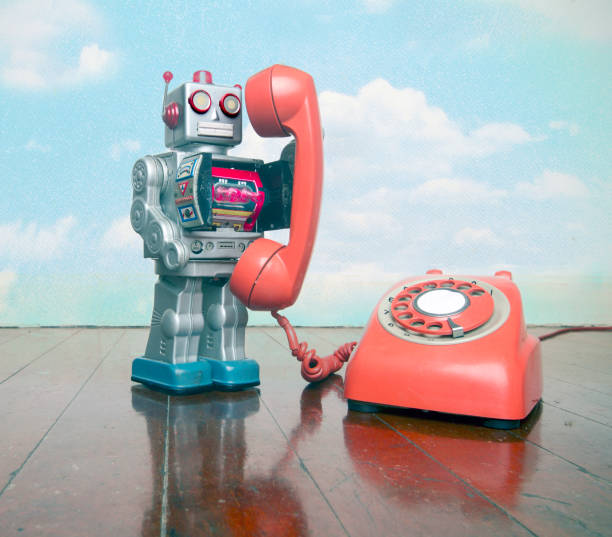 istock big silver robot toy on  a red phone standing on an old 1167204517