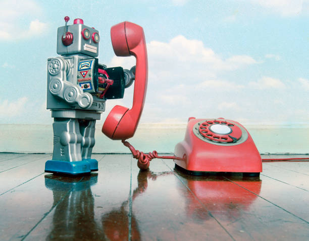 istock big silver robot toy on the phone 1167205577