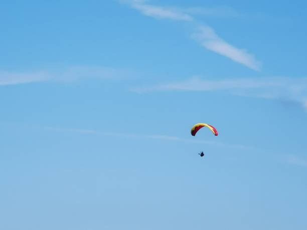 istock A skydiver in the Alps with a blue sky 1167207050