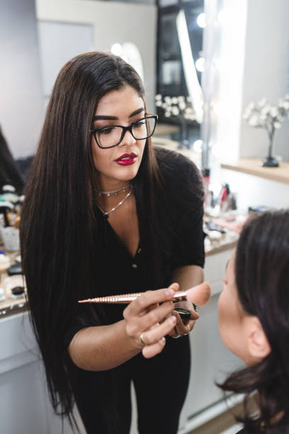 istock beauty professional applying makeup to a client in the studio 1167208755