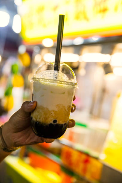 istock Hand holding cup with bubble milk- Taipei, Taiwan 1167209536