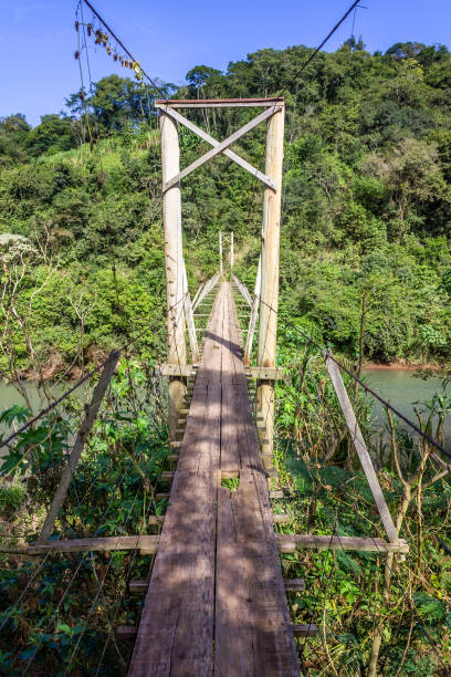 istock Iron and wood small bridge over a river 1167210650