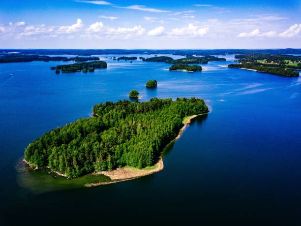 aerial landscape view over blue lakes with islands and green forests in finland. - coastline aerial view forest pond imagens e fotografias de stock