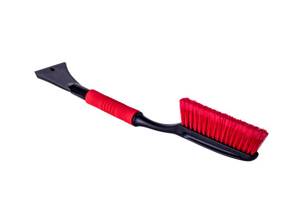 istock Car accessories for winter - plastic ice scrapers, red telescopic snow brushes with long handle on white background 1167212218
