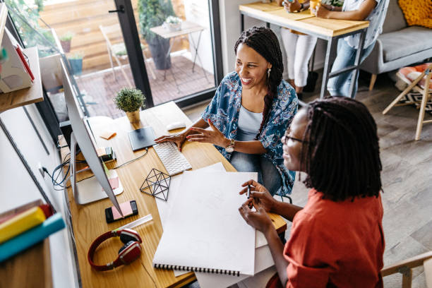 istock Female colleagues working together in office 1167212316