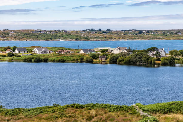 istock Bay with farm field and houses 1167213095