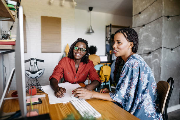 istock Female colleagues working together in office 1167213262