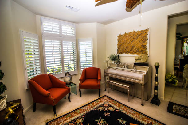 Sitting Room With Piano Sitting Room With Piano And Two Arm Chairs bay window stock pictures, royalty-free photos & images