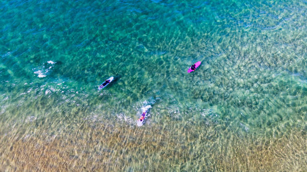 istock aerial image of men surfing 1167215677