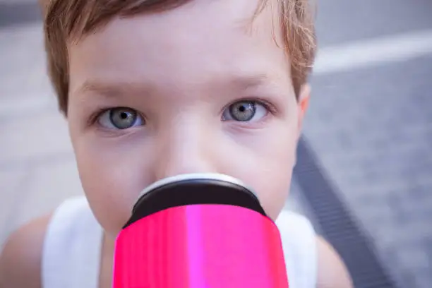 Photo of Children with unhealthy habit about sugary soft drinks