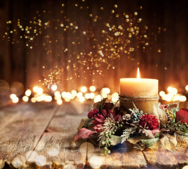 Holiday Candle Background Christmas holiday elegant candle set against Christmas lights and old textured and toned wood background candlelight photos stock pictures, royalty-free photos & images
