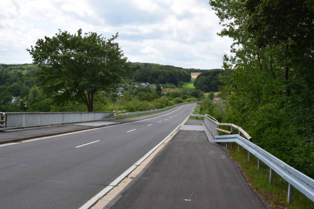 istock road across retaining wall of Freilinger See 1167223636