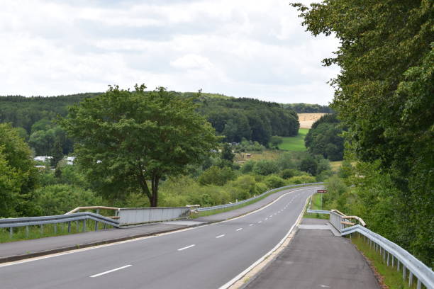 istock road across retaining wall of Freilinger See 1167224449