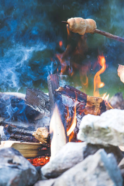 istock Baking bread over the fire: Barbecue outdoors with a bonfire 1167226912