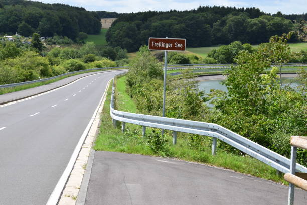 istock road across retaining wall of Freilinger See 1167226940