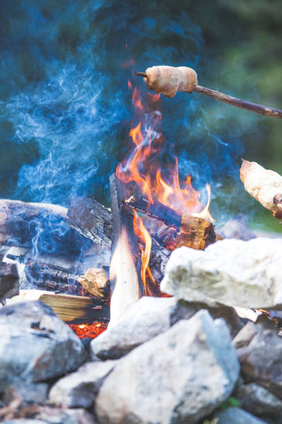 istock Baking bread over the fire: Barbecue outdoors with a bonfire 1167226958