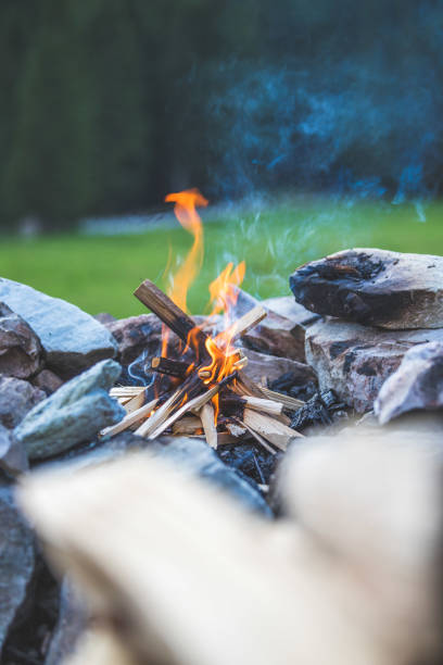 istock Making a bonfire: Small flame on a camping trip, adventure outdoors 1167228449