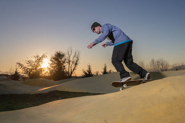 istock Skateboarder on a pump track park 1167231154