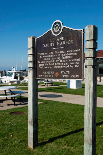 A sign gives info on the yacht harbor in the Leland Historic District (aka Fishtown) in Leland, Michigan, a small town on the Leelanau Peninsula outside Traverse City, Michigan. It is a very popular tourist destination.