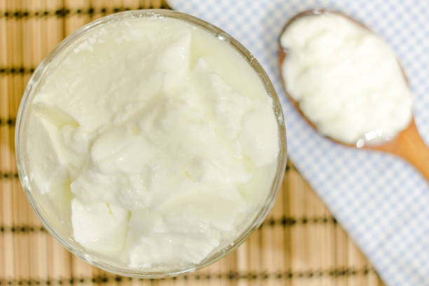 istock Natural homemade plain organic yogurt with wood spoon 1167238923