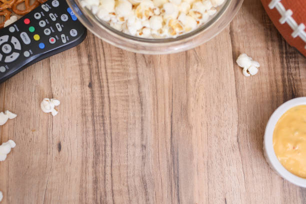 istock Watching the football game with snacks, drinks. 1167239879