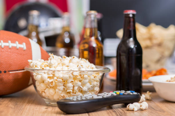 istock Watching the football game with snacks, drinks. 1167239882