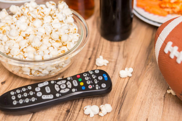 istock Watching the football game with snacks, drinks. 1167239885