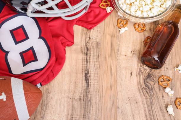 istock Watching the football game with snacks, drinks. 1167239917