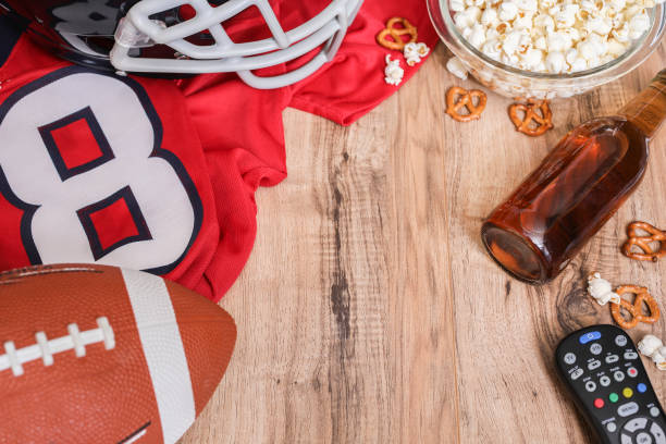 istock Watching the football game with snacks, drinks. 1167240470