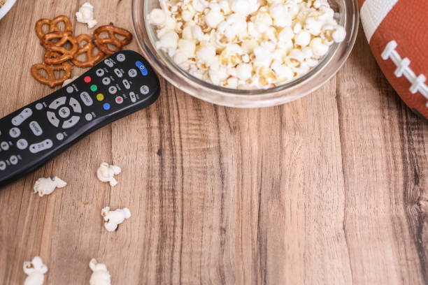 istock Watching the football game with snacks, drinks. 1167241024