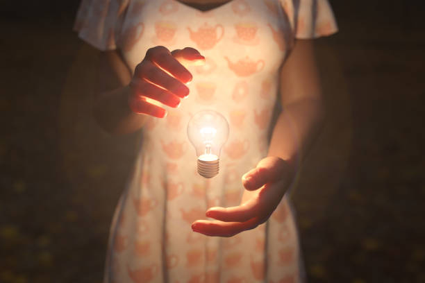 istock Woman Holding Floating Light Bulb 1167241653