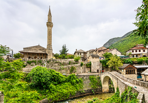 View of Nezir Agina Mosque and Crooked bridge in Mostar, Bosnia and Herzegovina