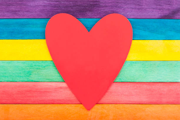 istock Empty heart note on colorful wooden background 1167244537