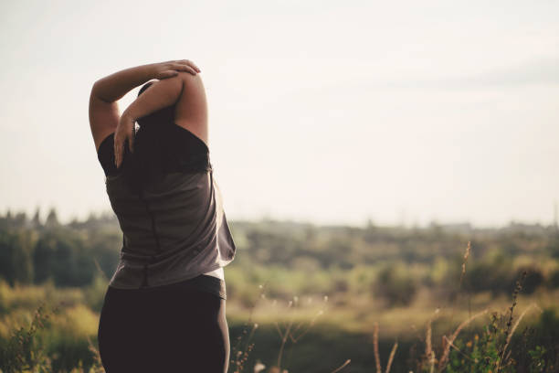 istock Overweight woman stretching hands during walk 1167244654